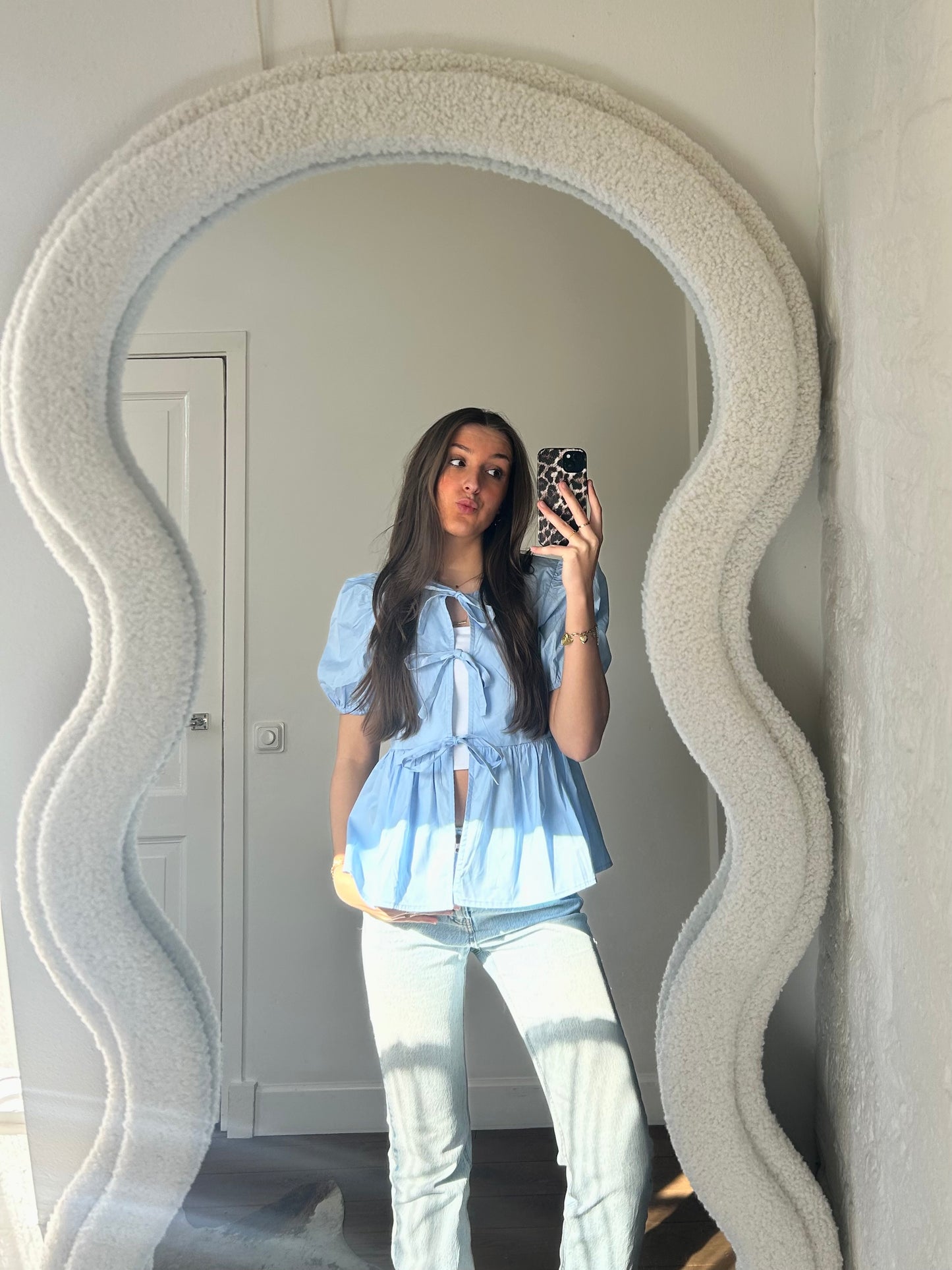 Peplum blouse met strikjes - lichtblauw